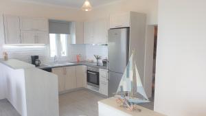 A kitchen or kitchenette at Sea View Private Pool Villa