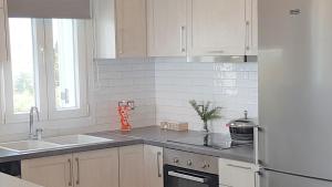 A kitchen or kitchenette at Sea View Private Pool Villa