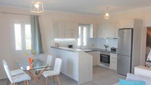 A kitchen or kitchenette at Sea View Private Pool Villa