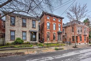 an old brick house on the corner of a street at Historic Victorian Home 3 Mi to Churchill Downs! in Louisville
