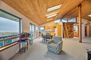 an open living room with a view of the ocean at Sanderling Sea Cottages, Unit A Pet Friendly! in Waldport