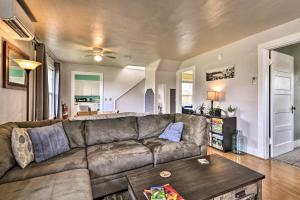 a living room with a couch and a table at Corner Cottage, Less Than 2 Mi to Columbia River, Vino in The Dalles