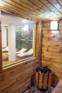 a room with a window in a wooden cabin at Hotel Apartamentos Regency La Feria in Bogotá
