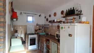 A kitchen or kitchenette at Öregporta Vendégház
