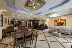 a restaurant with a dining room with tables and chairs at Sapphire Sapa Hotel in Sapa