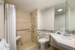 a bathroom with a toilet and a sink and a shower at Holiday Inn Express San Jose Costa Rica Airport by IHG in Alajuela City