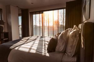 Postel nebo postele na pokoji v ubytování B&B Bleiswijk