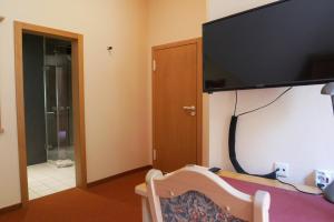 TV a/nebo společenská místnost v ubytování Hotel Gasthof Hereth