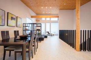 a dining room with a table and chairs at Hakuba MAHOROBA in Hakuba