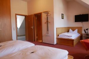 Postel nebo postele na pokoji v ubytování Hotel Gasthof Hereth