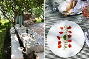 un tavolo con un piatto bianco di cibo e pane di Villa La Madonna a Monastero Bormida