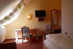 TV a/nebo společenská místnost v ubytování Hotel Gasthof Hereth