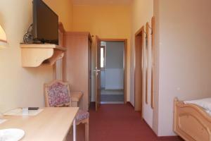 TV a/nebo společenská místnost v ubytování Hotel Gasthof Hereth