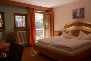 Postel nebo postele na pokoji v ubytování Hotel Gasthof Hereth