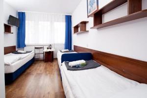 Llit o llits en una habitació de Ośrodek Wypoczynkowy Diuna Jastrzębia Góra