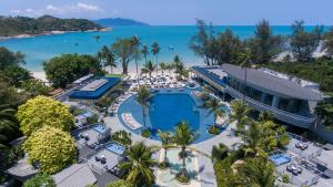 an aerial view of a resort with a pool and the beach at Melia Koh Samui in Choeng Mon Beach