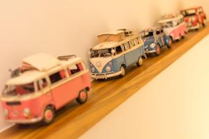 a group of toy cars are on a shelf at Miller Homestay in Wujie