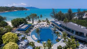 an aerial view of a resort with a pool and the beach at Melia Koh Samui in Choeng Mon Beach
