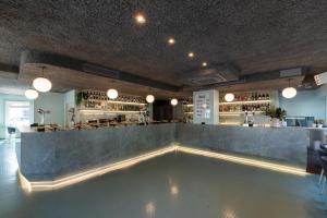 a bar with a counter in a room at Hotel Jauregui in Hondarribia