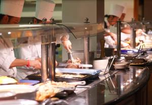 a group of chefs preparing food in a kitchen at Killarney Towers Hotel & Leisure Centre in Killarney