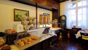 a bakery with a counter filled with lots of food at Hotel Johann in Warendorf