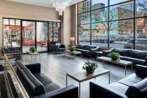 a lobby with couches and tables in a store at Travelodge by Wyndham Downtown Chicago in Chicago