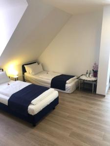 Ένα ή περισσότερα κρεβάτια σε δωμάτιο στο Hotel Johann