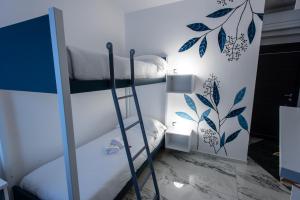 A bed or beds in a room at Elly's B&B