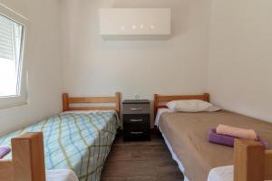 Postel nebo postele na pokoji v ubytování Apartmani Lana