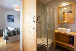 a bathroom with a shower and a toilet and a sink at Residence Miravidi La Rosiere in La Rosière +126 photos