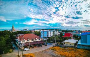 a view of a city with buildings and a cloudy sky at Tree House Chachoengsao in Chachoengsao