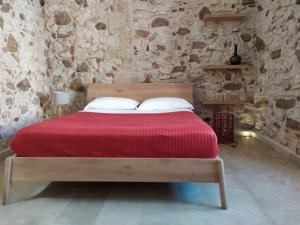 Voodi või voodid majutusasutuse Chiusa Di Carlo Agriturismo toas