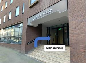 a main entrance to a main entrance of a building at Book our Royal Suite today! Elegant spacious 2 bed apartment in the city centre - perfect for work or leisure! in Sheffield