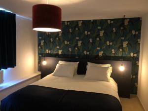 Postel nebo postele na pokoji v ubytování B&B Maison Ruthier