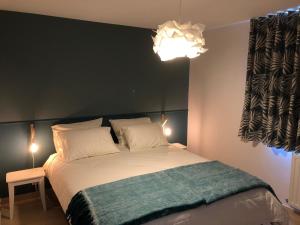 Postel nebo postele na pokoji v ubytování B&B Maison Ruthier