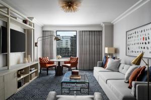 a living room with a couch and a table at Four Seasons Hotel Atlanta in Atlanta