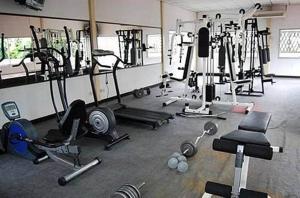 a gym with many different types of equipment in it at King Royal Garden Inn in Bangkok