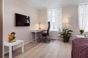 TV a/nebo společenská místnost v ubytování Trondheim Leilighetshotel