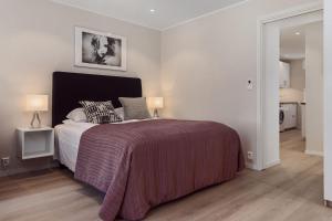 Postel nebo postele na pokoji v ubytování Trondheim Leilighetshotel
