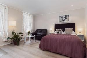 Postel nebo postele na pokoji v ubytování Trondheim Leilighetshotel