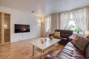 TV a/nebo společenská místnost v ubytování Trondheim Leilighetshotel