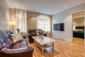 TV a/nebo společenská místnost v ubytování Trondheim Leilighetshotel