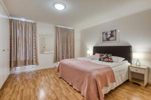 Postel nebo postele na pokoji v ubytování Trondheim Leilighetshotel