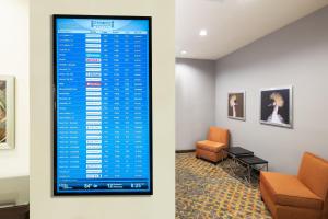 a waiting room with a sign on the wall at Staybridge Suites - Miami International Airport by IHG in Miami
