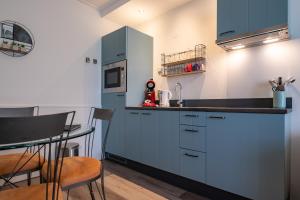 Kuchyň nebo kuchyňský kout v ubytování Hotel Almenum - het sfeervolle stadslogement -