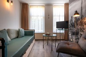 Χώρος καθιστικού στο Hotel Almenum - het sfeervolle stadslogement -