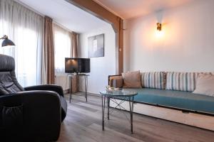 TV a/nebo společenská místnost v ubytování Hotel Almenum - het sfeervolle stadslogement -