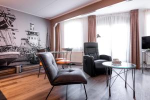 TV a/nebo společenská místnost v ubytování Hotel Almenum - het sfeervolle stadslogement -