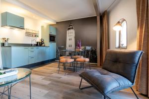 Kuchyň nebo kuchyňský kout v ubytování Hotel Almenum - het sfeervolle stadslogement -