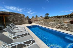 Bazén v ubytování Anfi Tauro Golf Villa with private heated pool nebo v jeho okolí